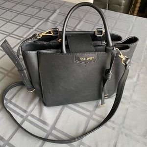 New, 3 sections, zipped center, removable & adjustable shoulder strap, no tags.